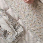 A baby wipes cover and changing cushion in nature trail