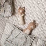 A cute teddy bears and baby wipes cover placed on top of a travel changing mat nature trail