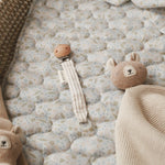 Cute pacifier holder on top of cotton liner nature trail