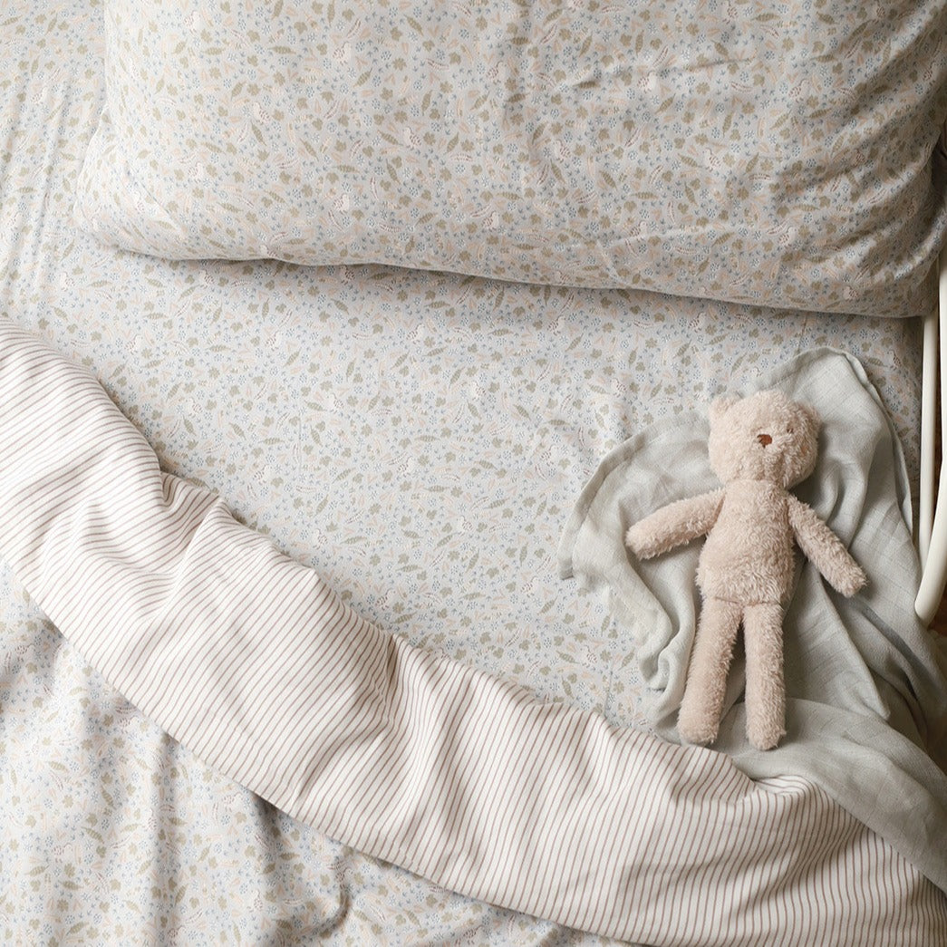 A cute teddy bear on a nature trail bedding set