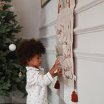A kid playing with advent calendar - the nutcracker