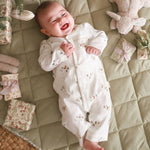 All smile baby in a sleepsuit winter ski design