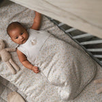 Baby wearing sleeping bag in quail design