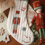 The nutcracker and Christmas stocking on a table