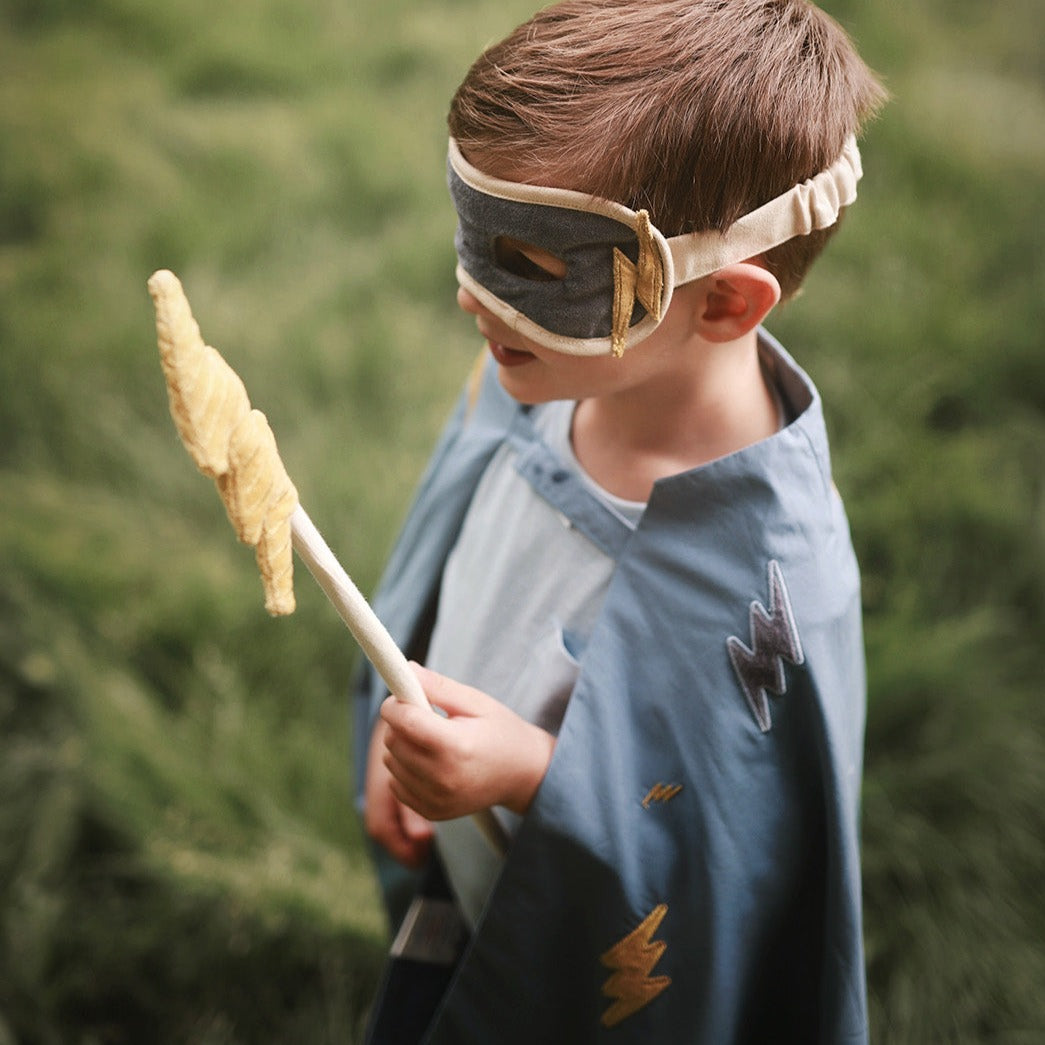 velvet mask and yellow lightning bolt wand