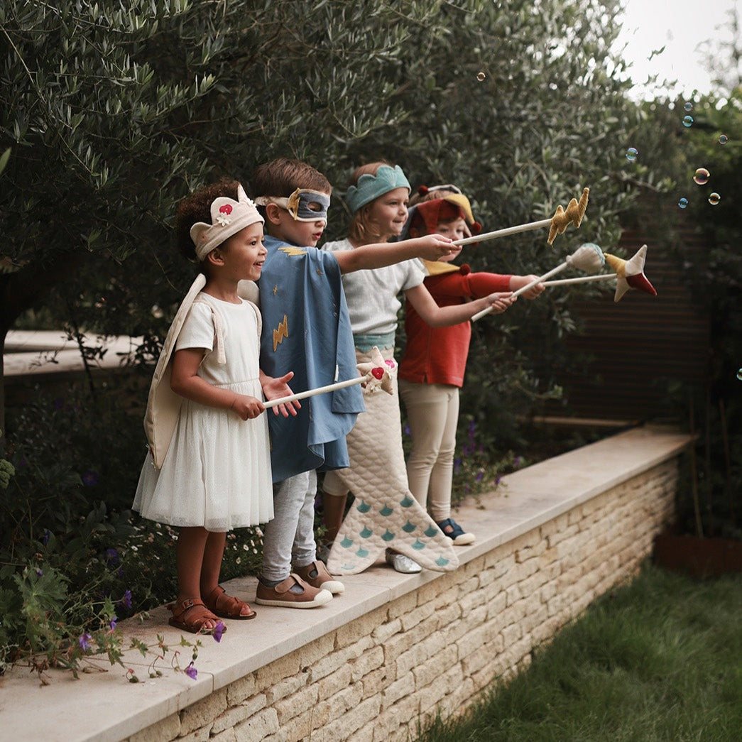 kids playing dress-up outside