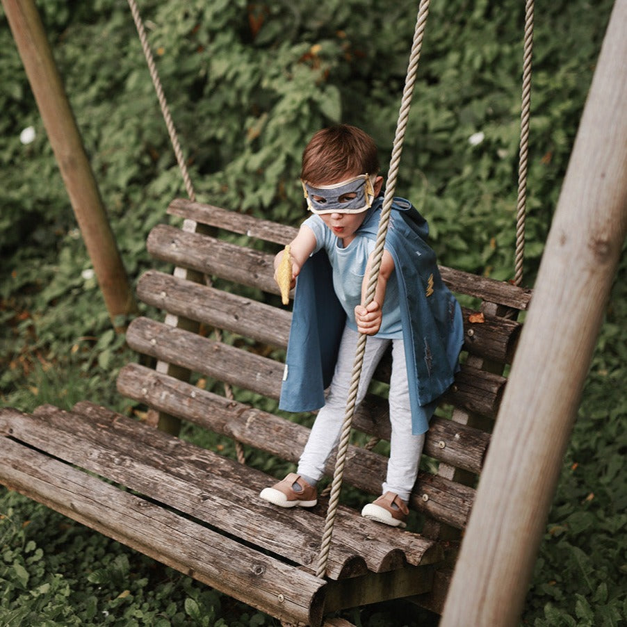 a boy playing with lightning bolt wand